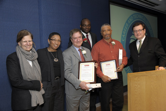 Stanley Bellis (with plaque, left) and Freddie Cole, the winners of the Stanley Schair CTE Teacher Award for Excellence and Innovation given by the Advisory Council for CTE, with (from left) Sandra Schair, the wife of the award’s namesake; Florence Jackson from the Department of Education; Roberson; and council Chair Jack Powers. Stanley Bellis (with plaque, left) and Freddie Cole, the winners of the Stanley Schair CTE Teacher Award for Excellence and Innovation given by the Advisory Council for CTE, with (from left) Sandra Schair, the wife of the award’s namesake; Florence Jackson from the Department of Education; Roberson; and council Chair Jack Powers. (Miller Photography)
