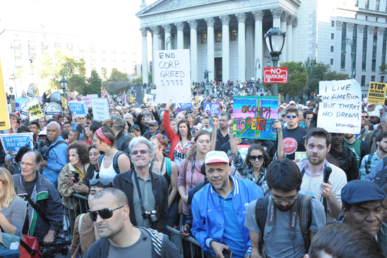 Tens of thousands of students, union members and unemployed or underemployed youth gather at Foley Square for an Oct. 5 community-labor rally against Wall Street greed. Tens of thousands of students, union members and unemployed or underemployed youth gather at Foley Square for an Oct. 5 community-labor rally against Wall Street greed. The vast crowd covered the entire square, spilling over onto the steps of the nearby New York State Supreme Courthouse. UFT Bronx Borough Representative Jose Vargas (center, with cap) was among the many UFT members present. (Miller Photography)