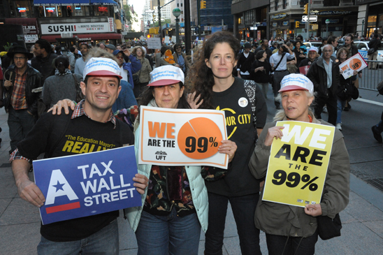 UFT members turned out in tremendous numbers for the massive protest. UFT members turned out in tremendous numbers for the massive protest. This group, sporting T-shirts from previous rallies, includes (from left) Edrick Carrero of JHS 117 in the Bronx, Madeline Moch of PS 98 in Manhattan, Sarah Leaman of PS 321 in Brooklyn and retired UFTer Judy Zemlock. (Miller Photography)
