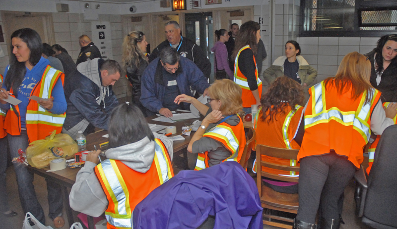 Answering the call Things are hopping at the hurricane shelter at Tottenville HS on Staten Island, where UFT members and other city workers helped in whatever ways they could.