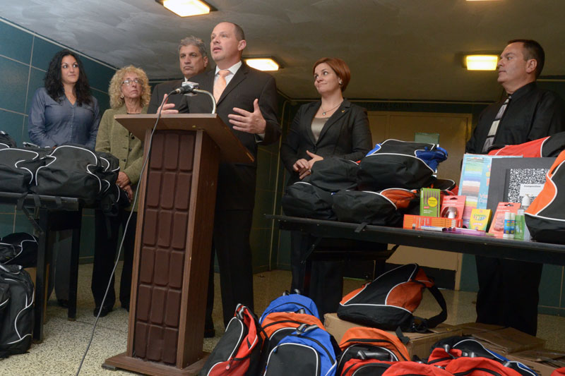 Surrounded by hundreds of backpacks filled with school supplies, UFT President Michael Mulgrew thanks educators and elected officials for their work supporting students affected by the hurricane, including (from left) IS 281 Principal Maria Bender, UFT District 21 Representative Judy Gerowitz, City Councilman Domenic Recchia, City Council Speaker Christine Quinn and PS 188 Principal Frederick Tudda. Surrounded by hundreds of backpacks filled with school supplies, UFT President Michael Mulgrew thanks educators and elected officials for their work supporting students affected by the hurricane, including (from left) IS 281 Principal Maria Bender, UFT District 21 Representative Judy Gerowitz, City Councilman Domenic Recchia, City Council Speaker Christine Quinn and PS 188 Principal Frederick Tudda. (Miller Photography)