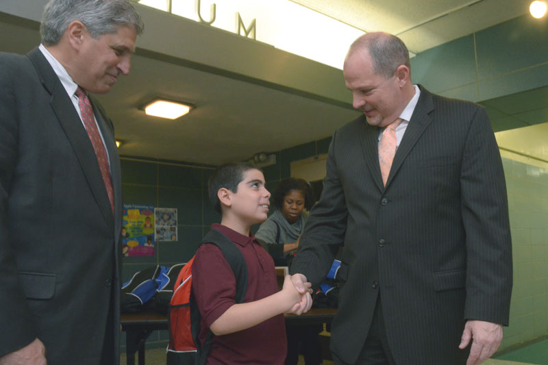 Mulgrew shakes hands with a 5th-grader, while City Councilman Domenic Recchia looks on. Mulgrew shakes hands with a 5th-grader, while City Councilman Domenic Recchia looks on. (Miller Photography)