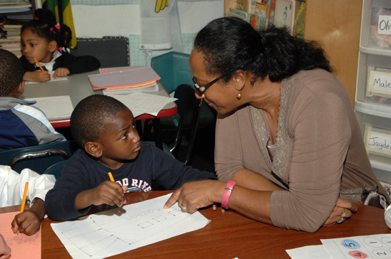 UFT family child care provider Linette Ebanks works with Karson.