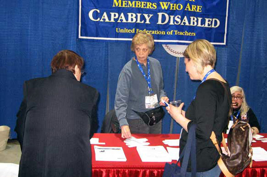 Retired teacher Abbe Nosoff, a part-time UFT staffer and member of the committee, holds down the fort with Herbst at the Capably Disabled table at the NYSUT RA in April 2009. Retired teacher Abbe Nosoff, a part-time UFT staffer and member of the committee, holds down the fort with Herbst at the Capably Disabled table at the NYSUT RA in April 2009.
