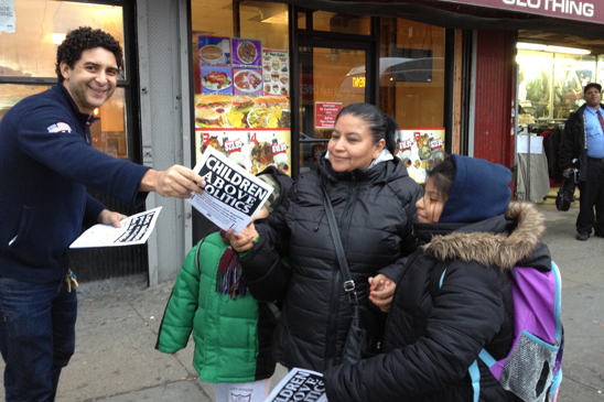 “Children Above Politics” Day of Action - D12 Oscar Gell, Delegate from CS211 in the Bronx, leaflets after school at the corner of Southern Boulevard and East Tremont in the Bronx.