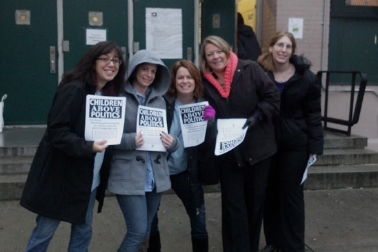 Educators from PS 272, Brooklyn hand out leaflets before the start of the school day. Educators from PS 272, Brooklyn hand out leaflets before the start of the school day.