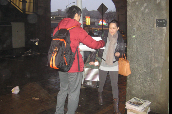 “Children Above Politics” Day of Action - IS 125 Queens - 3 Member Edward Weng-Lin (wearing red jacket) of IS 125 in Queens distributes leaflets to public.