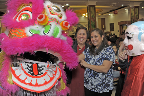 Retiree Patricia Leung (left) and Ita Ramirez-Irizarry from PS 153, Queens, were among the 400 revelers at the Lunar New Year banquet in Chinatown. (Dave Sanders)