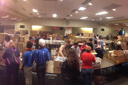 Shanker Hall is a hub of activity as members stuff backpacks with supplies for displaced students. (David Kazansky)
