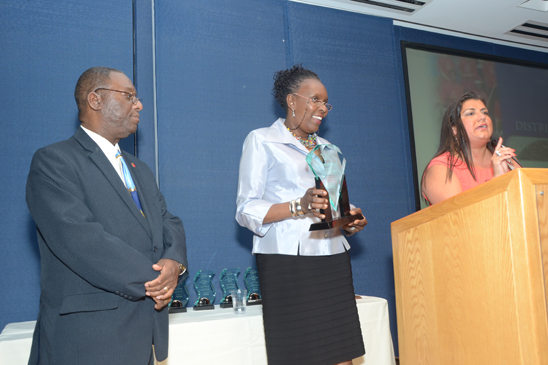 Five educators honored - 3 Colvin and Shelia Laval-Friedman, of the UFT's Victim Support Program, look on as Manhattan Borough Representative Evelyn DeJesus addresses the gathering. (Miller Photography)