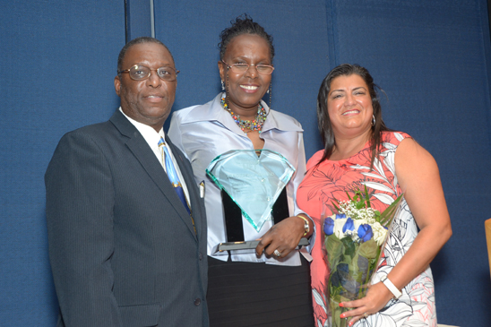Five educators honored - 5 Colvin, Laval-Friedman and DeJesus pose for a photograph. (Miller Photography)