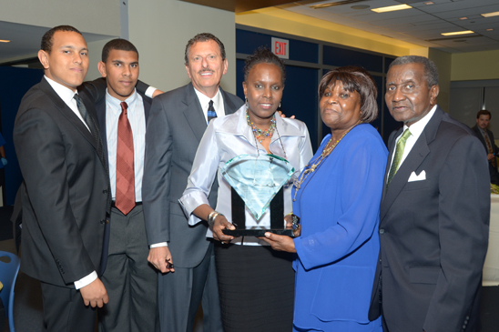 Five educators honored - 16 Laval-Friedman (center) poses with her family, including (l to r) sons Andre and Mathew and husband Charles Friedman and parents Ann and William Laval. (Miller Photography)