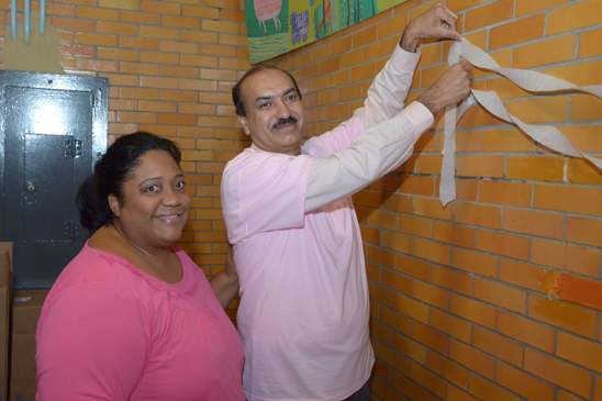 Go pink 2012: Raising awareness for Breast Cancer - PS 151 Queens - 3 Naida Ryans, the parent coordinator, and Ahmed Shakeel, a paraprofessional, both at PS 151 in Queens. (Miller Photography)