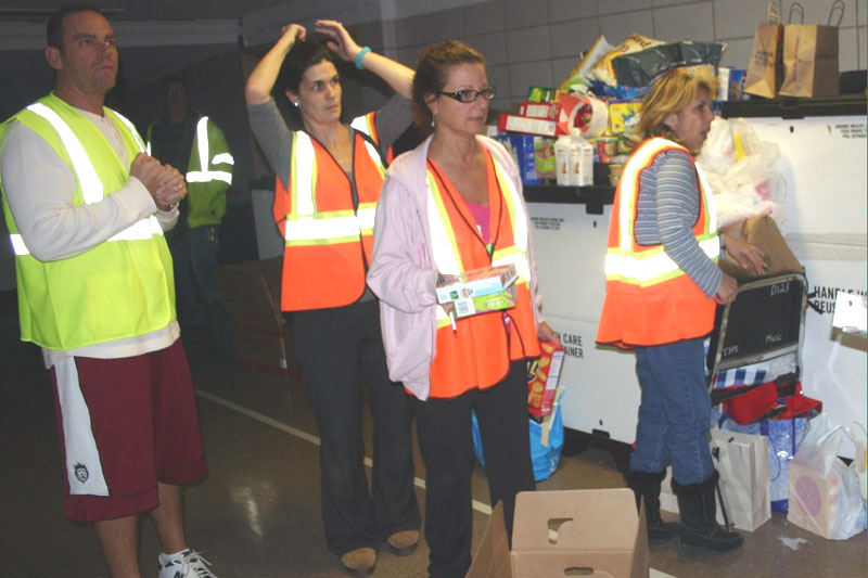 UFTers volunteering at the Tottenville HS evacuation center. UFTers volunteering at the Tottenville HS evacuation center. From left: Guido Caligara, teacher at Grady HS, Brooklyn; Eileen Cappello, hospital instructor at Richmond University Medical Center; Dolores DeMaio, payroll secretary at PS 42, Staten Island. (Michael LoVerde)