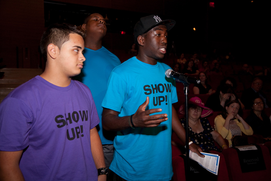 Student Michael Joseph, who was part of a skit on sexting that opened the summit, described how his school successfully ended a spate of cyberbullying by working with ENACT, a nonprofit organization that uses drama to teach social and emotional skills to students, parents and educators. He shared that a good friend who committed suicide two weeks ago had been cyber-bullied for her sexuality. To his left is fellow ENACT performer Antonio. (Pat Arnow)