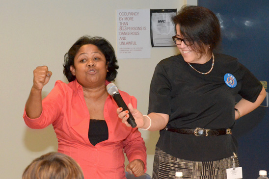 Esther Moreno of the Dr. Horan School, PS 79 in Manhattan, blasts the Teacher Effectiveness Program as District 75 Representative Analia Gerard holds the microphone. Esther Moreno of the Dr. Horan School, PS 79 in Manhattan, blasts the Teacher Effectiveness Program as District 75 Representative Analia Gerard holds the microphone. (Miller Photography)
