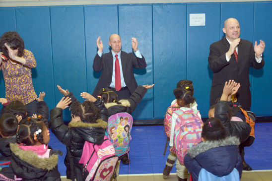 Students, educators and union leaders start the day with a morning song and dance. (Miller Photography)