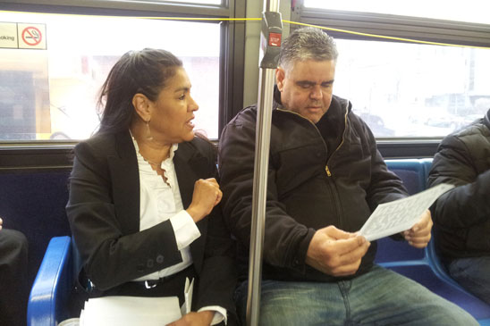 District Representative Myra Cruz talks to a commuter on the M7 bus about the need to reach a fair evaluation agreement. District Representative Myra Cruz talks to a commuter on the M7 bus about the need to reach a fair evaluation agreement.