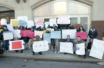 Parents and faculty bring their case to the public. One sign read: “Honk if you 