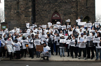 Marchers gather outside the church before filing in.