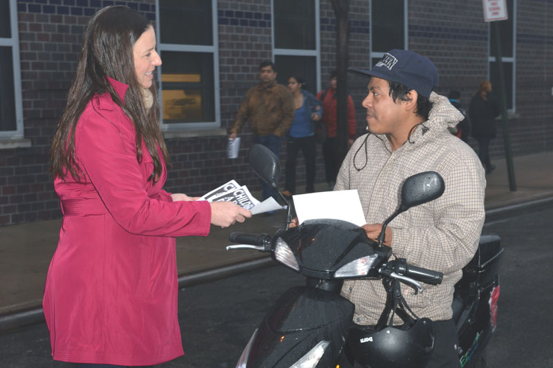 Jennifer Jaeger, a teacher at PS 239 in Queens, stops passer-by Louis Migar on his scooter to hand him a flier on a citywide Day of Action on Jan. 14.
Jennifer Jaeger, a teacher at PS 239 in Queens, stops passer-by Louis Migar on his scooter to hand him a flier on a citywide Day of Action on Jan. 14.
(Miller Photography)