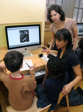 Third-graders and teacher Grace Chang get a lesson on how to use the NYPL catalo