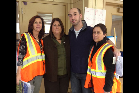 Adriana OHagan, Chapter Leader at KAPPA V - MS 518, volunteering at Tottenville HIgh School. Assistant Principal Kathy Driscoll, special ed teacher David Schwartz and Chapter Leader Adriana O'Hagan of MS 518 volunteer at Tottenville HS, which gave shelter to hurricane evacuees.