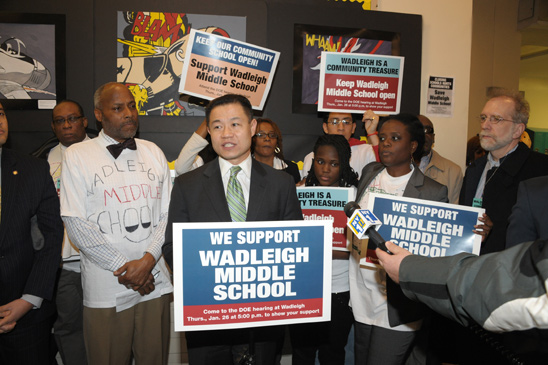Flanked by State Senator Bill Perkins (left) and UFT Vice President Leo Casey (far right), New York City Comptroller John Liu condemns the DOE’s plan to eliminate Wadleigh’s middle grades. Flanked by State Senator Bill Perkins (left) and UFT Vice President Leo Casey (far right), New York City Comptroller John Liu condemns the DOE’s plan to eliminate Wadleigh’s middle grades. (Miller Photography)