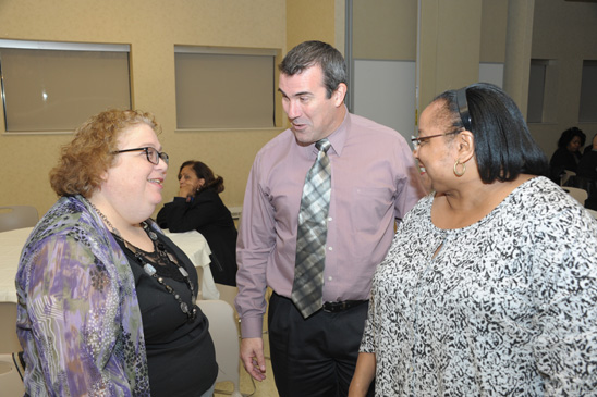 Getting to know you: Eve Rittle, a secretary, and Greg Quinn, a social worker, both at Collegiate Institute of Math and Science, and Lorraine Hunter, a paraprofessional at Christopher Columbus HS. (Miller Photography)