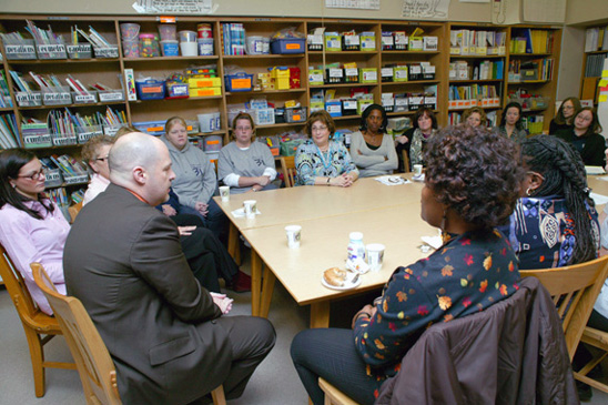 PS 31 staffers listen intently as Mulgrew explains the budget crisis facing city and state governments and how they will impact on education.