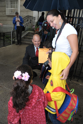 UFT President Michael Mulgrew helps welcome children on the first day of school 