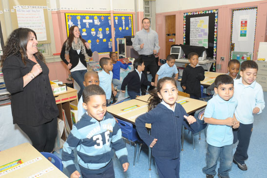Kindergarteners are running in place to get rid of the wiggles with inspiration 
