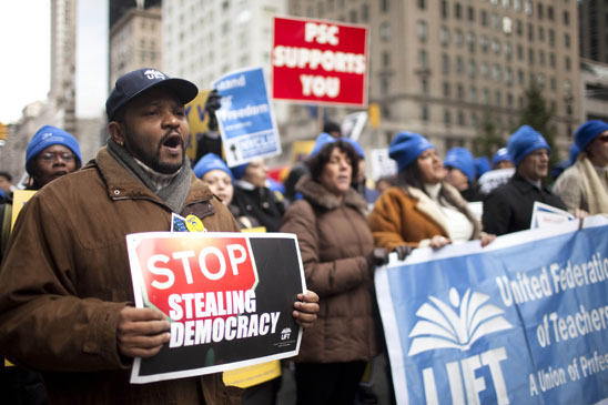 At left is UFT Director of Parent and Community Outreach Anthony Harmon. (Dave Sanders)