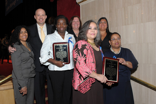 Partnership Award - Manhattan Partnership Award - Manhattan: Holding their plaques are (third from left) PS 123 Chapter Leader Ernestine Augustus and PS 178 Chapter Leader Dalia Gonzalez (far right) with Principal Deidre Budd at her left. Joining them are (from left) District 6 Representative Mayra Cruz (left) and Mulgrew, Engler and Manhattan Borough Representative Evelyn DeJesus. PS 123 Principal Dr. Beverly Lewis was unable to attend. (Miller Photography)