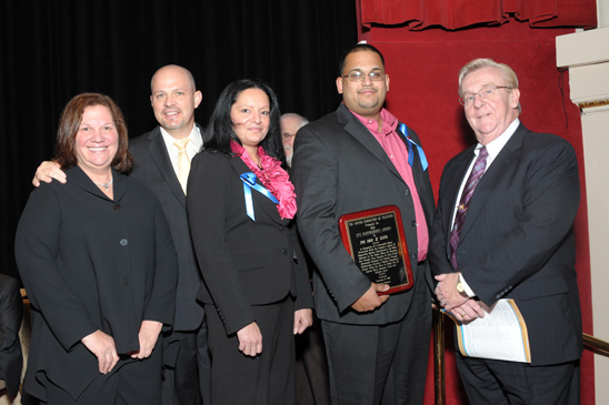 Partnership Award - District 75 Partnership Award - District 75: Awardees from PS 168 in the Bronx are Principial Rosa Nieves Greene (third from left) and Chapter Leader David Doorga (holding plaque) with (from left) Engler, Mulgrew and District 75 Representative Walter O’Leary. (Miller Photography)