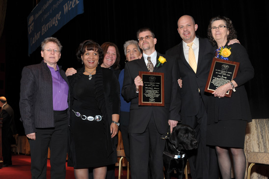 Sidney Harris Award Sidney Harris Award: Awardees (holding plaques) Matthew Brown, the chapter leader of PS 36 in Brooklyn, and Liz Truly of the UFT special education department, with (from left) PS 36 Principal Johanna Schneider, UFT Vice President for Special Education Carmen Alvarez, Engler, UFT Queens Borough Representative Rona Freiser and Mulgrew. (Miller Photography)