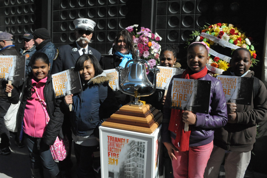 Students from PS 134, Manhattan with retired fire captain Sal Canale at the site of the Asch Building in Greenwich Village Students from PS 134, Manhattan with retired fire captain Sal Canale at the site of the Asch Building in Greenwich Village which housed the shirtwaist factory. The bell was rung and a flower placed for each of the workers who lost their lives. (Miller Photography)