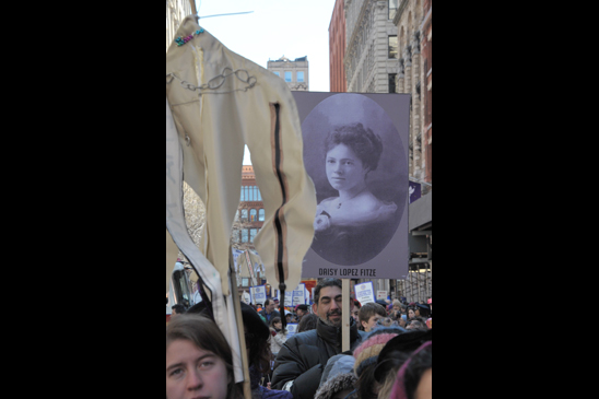 The crowd honored those who lost their lives with signs, photos and stories. The crowd honored those who lost their lives with signs, photos and stories. (Miller Photography)