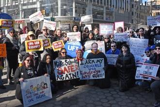 UFT members hold up their signs at the March for our Lives in Manhattan