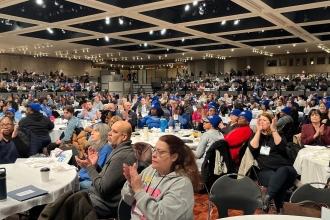 A large group of UFT members pack a convention center in Albany