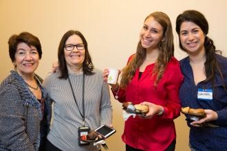 Four women pose for a photo at a conference for school counselors.