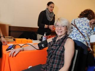 Linda Lee Ecker, a para at PS 527 in Manhattan, has a blood pressure screening.