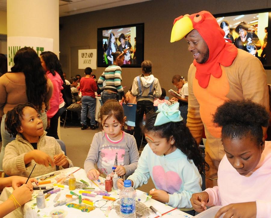 Chapter Advocate Rashad Brown dons a turkey costume to the delight of children d