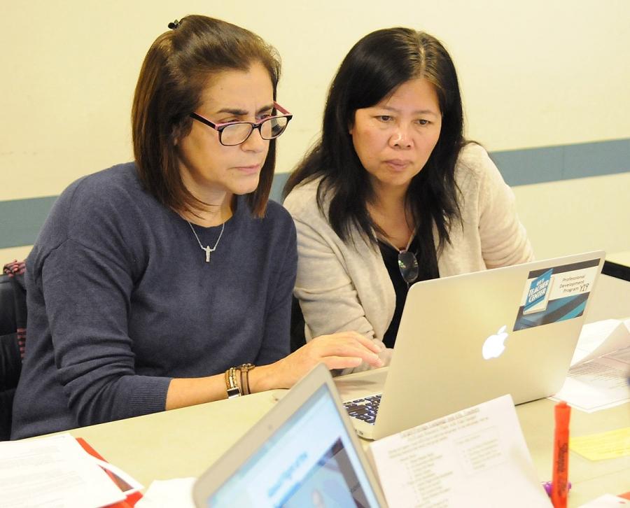Paraprofessionals Suely Souto Maior (left) and Qi Dan Lei, from PS 503 in Brookl