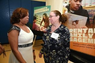 UFT Vice President for Elementary Schools Karen Alford (left) chats with teacher