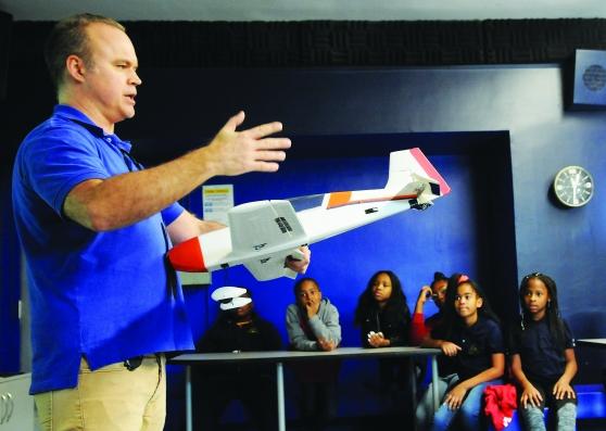 A man demonstrates a model plane