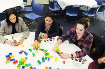 Participants work on a project with Duplo bricks during the Early Childhood LEGO