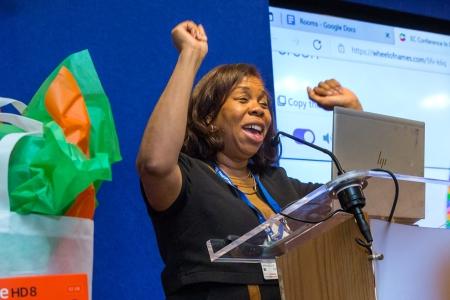 UFT Vice President for Elementary Schools Karen Alford celebrates a raffle giveaway.