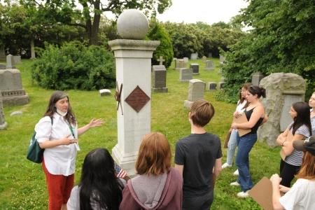 Rachel Walman, Green-Wood’s education director, introduces Park Slope Collegiate 7th-graders to the final resting place of Henry Chadwick