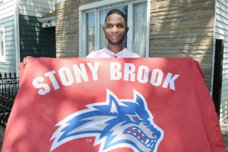 Teenager holding Stony Brook banner